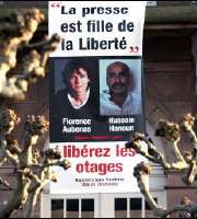 Florence Aubenas and Hussein Hanoun into Place de la Repubblic